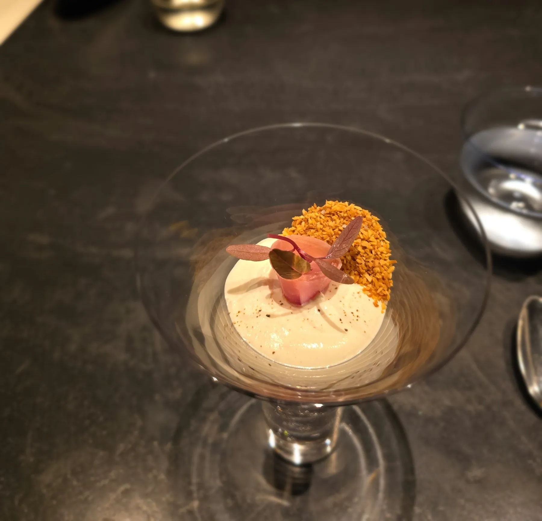 Glass coupe with trout, crumble, and foam