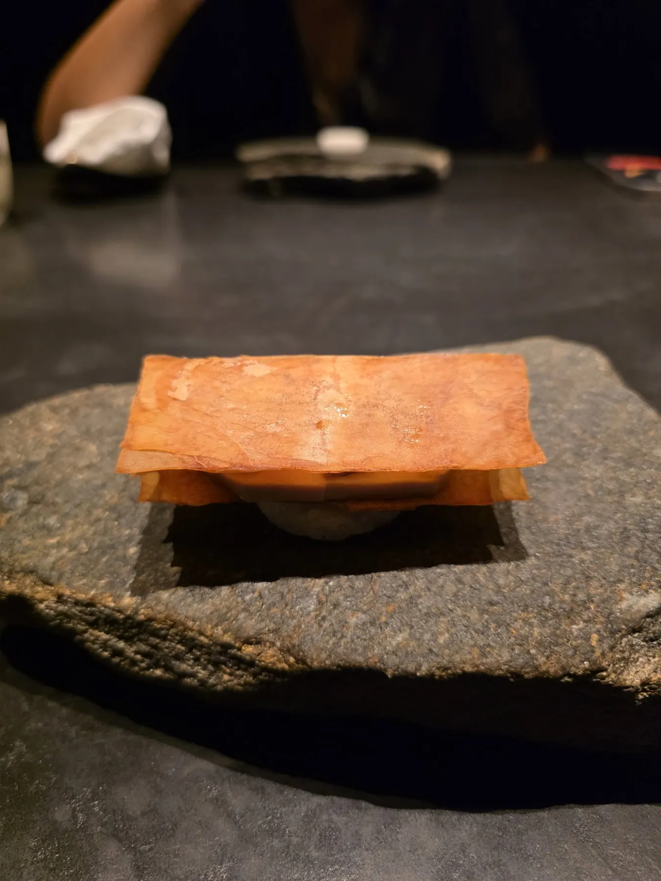 Layered wafer on a river stone