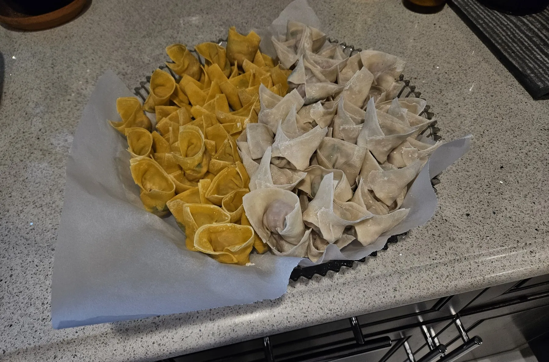 Tray of uncooked homemade dumplings