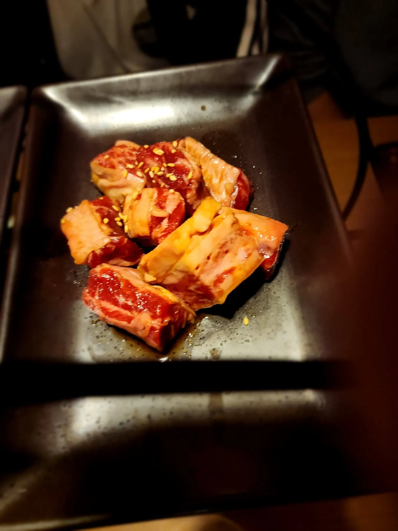 Marinated short rib on a black plate
