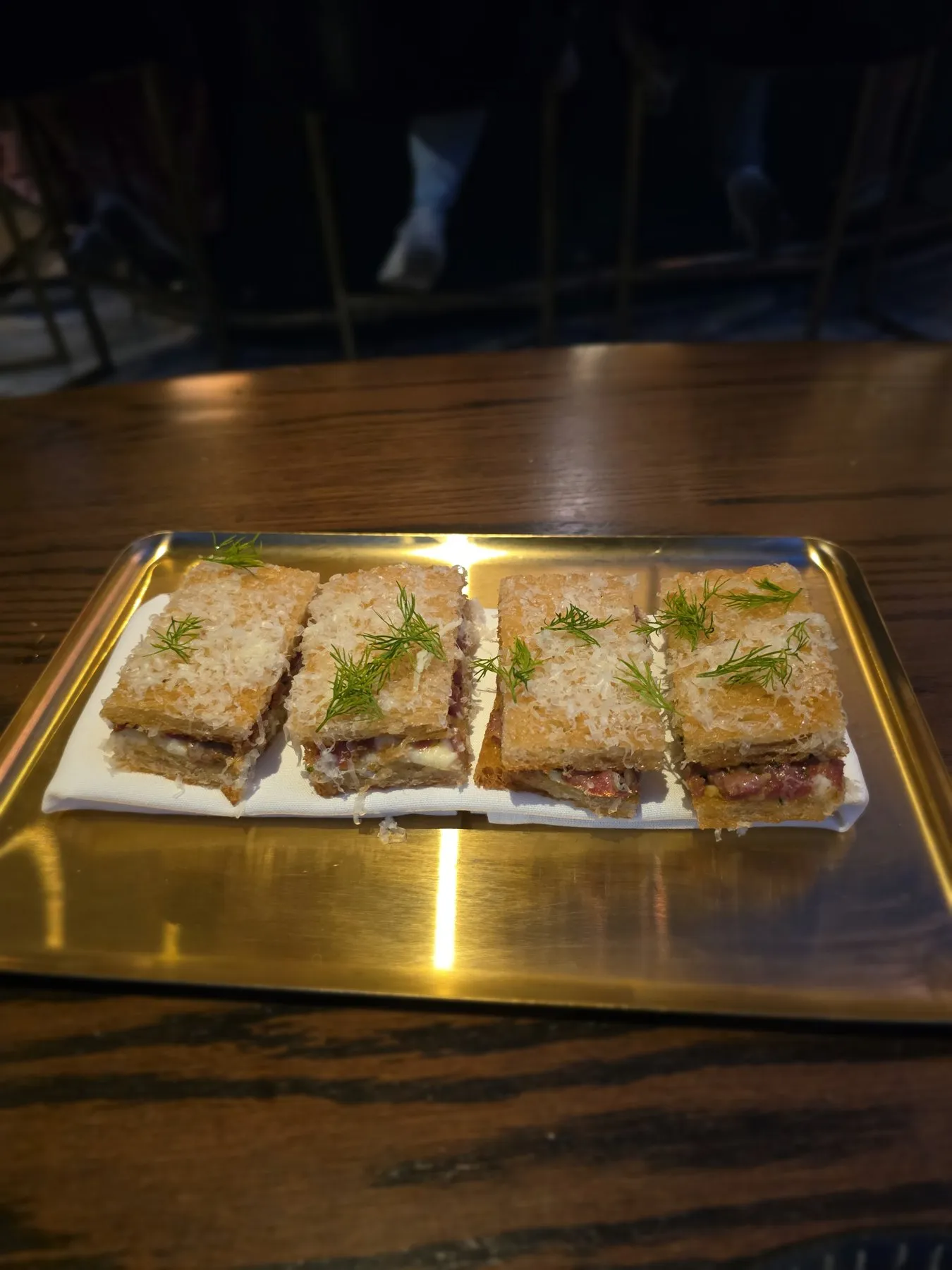 Katsu sandwiches on a brass tray