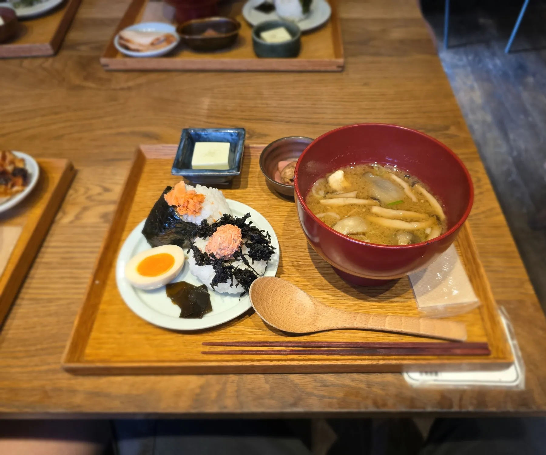 Japanese breakfast tray with miso soup, rice, and pickles