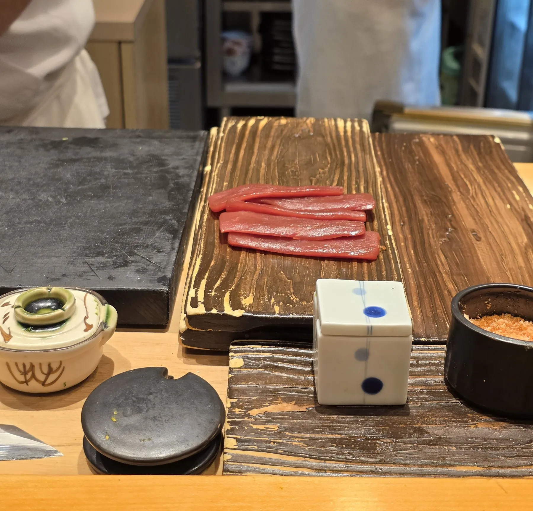 Slices of tuna on a wooden cutting board