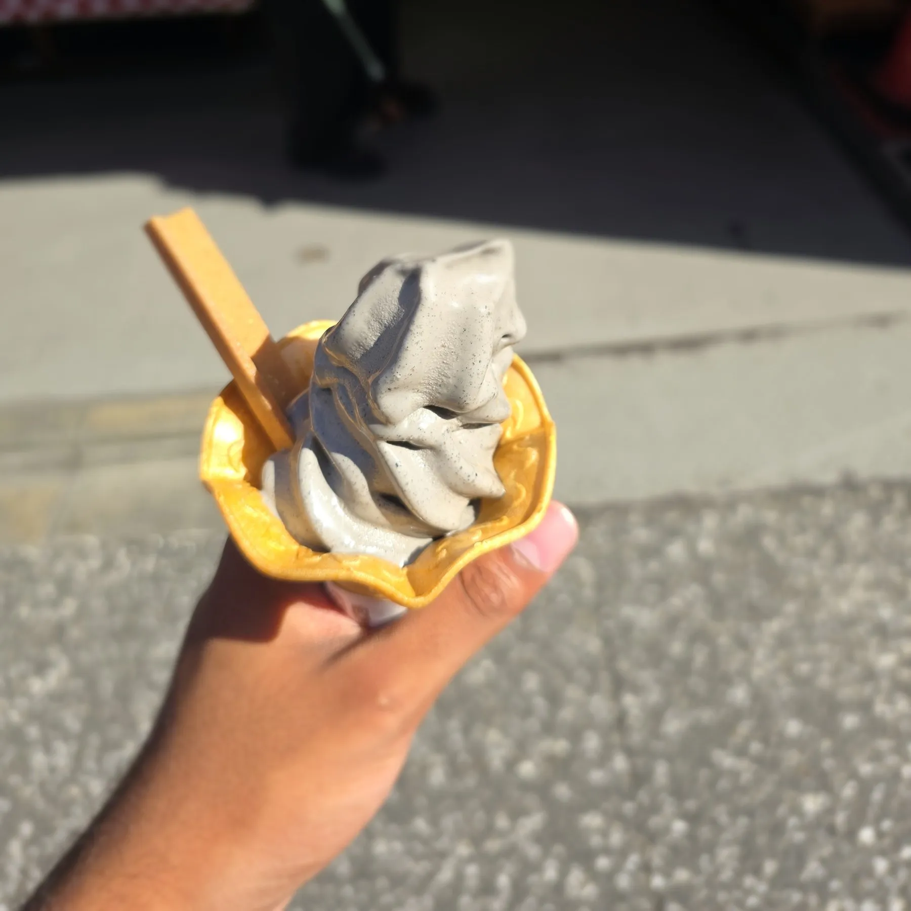 Black sesame soft serve in a wafer shell