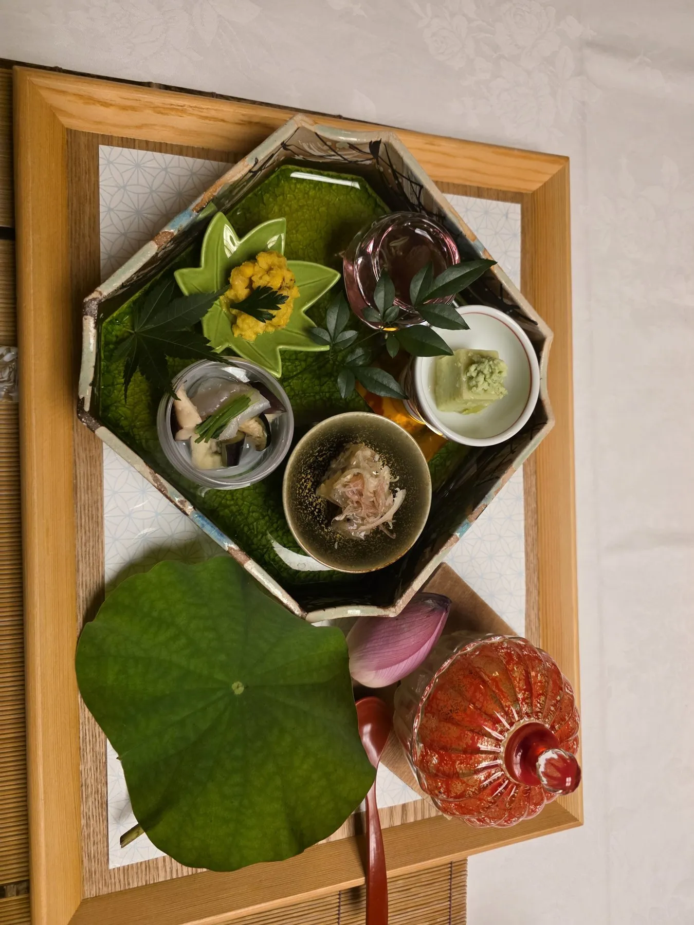 Kaiseki appetizer tray on a lotus leaf
