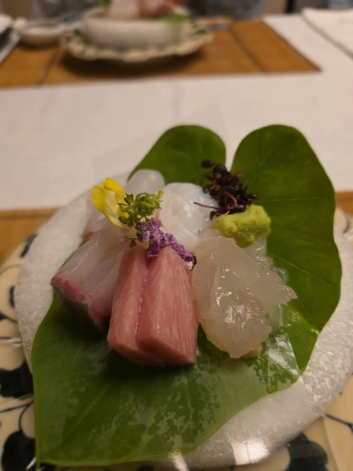 Sashimi arranged on a green leaf